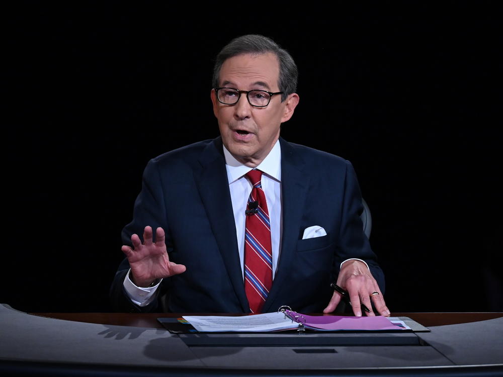 Chris Wallace of Fox News moderates a 2020 presidential debate. Wallace says he's leaving the network after 18 years and is 