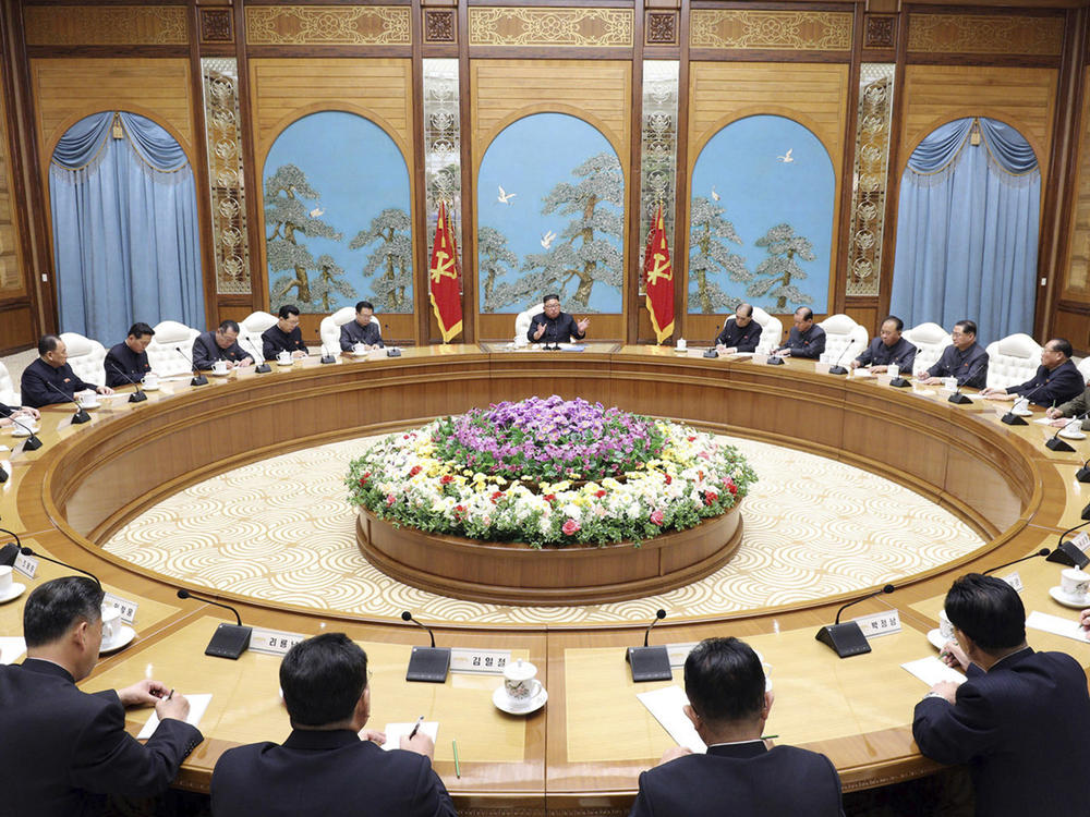 In this April 2020 file photo provided by the North Korean government, Kim Jong Un, center top, attends a politburo meeting of the ruling Workers' Party of Korea in Pyongyang.