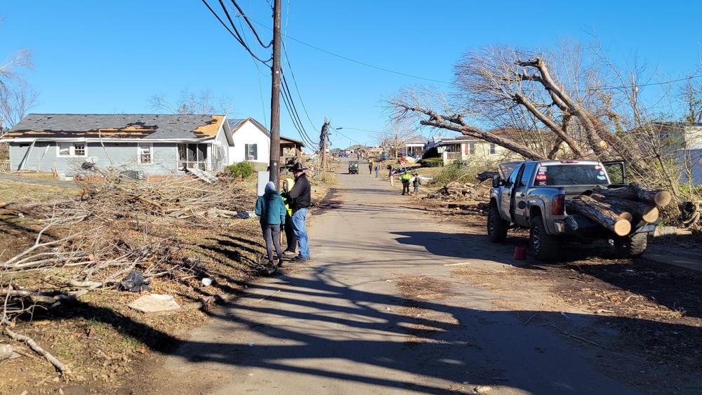 With more than 100 people still missing in Kentucky, search-and-recovery crews are working in devastated neighborhoods like this one in Dawson Springs.
