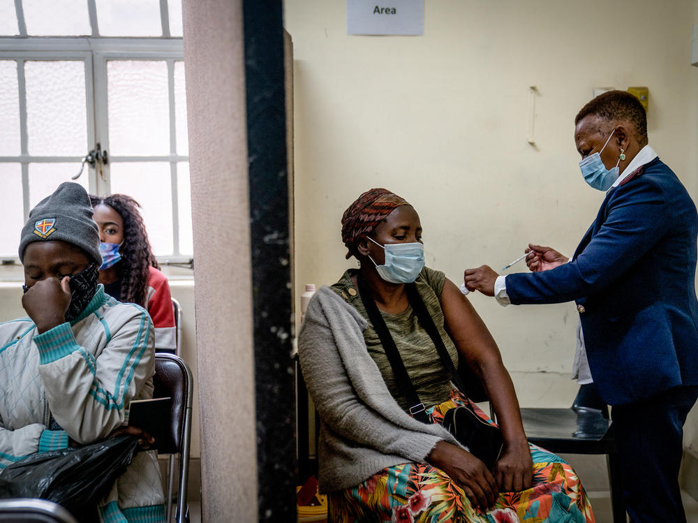 A woman is vaccinated against COVID-19 at a clinic in Johannesburg on Dec. 6. A new study from South Africa looks at the effectiveness of the Pfizer vaccine in preventing infection and severe disease.