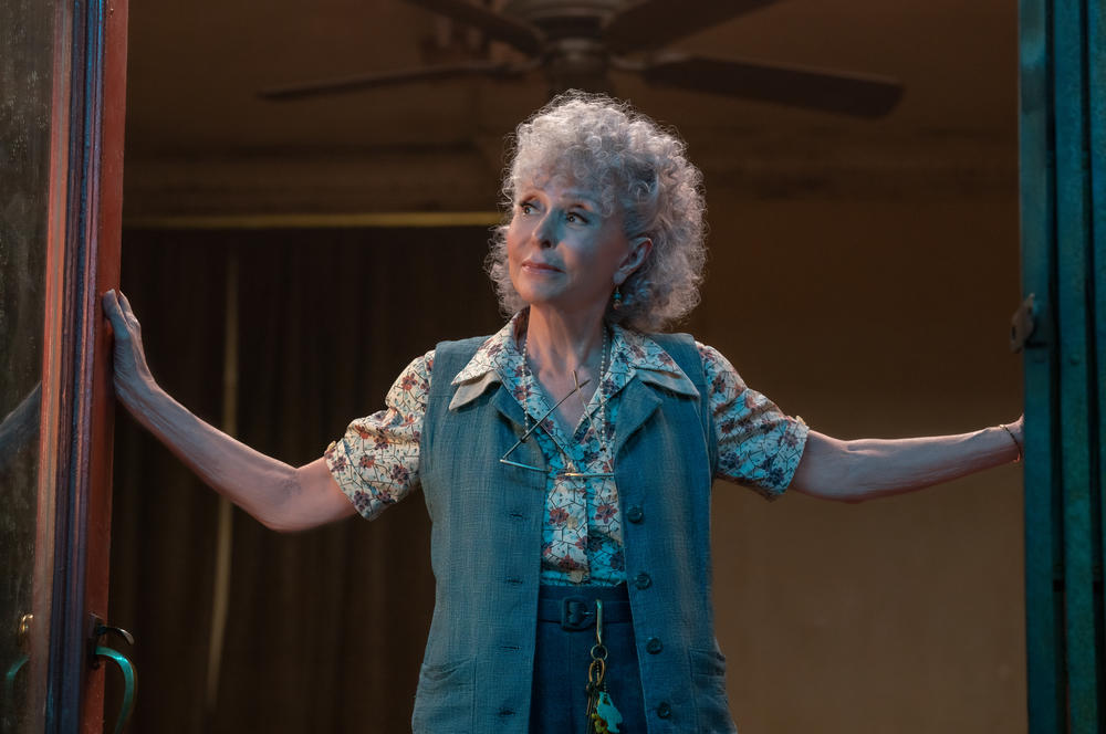 Rita Moreno as Valentina in 20th Century Studios' <em>West Side Story</em>.
