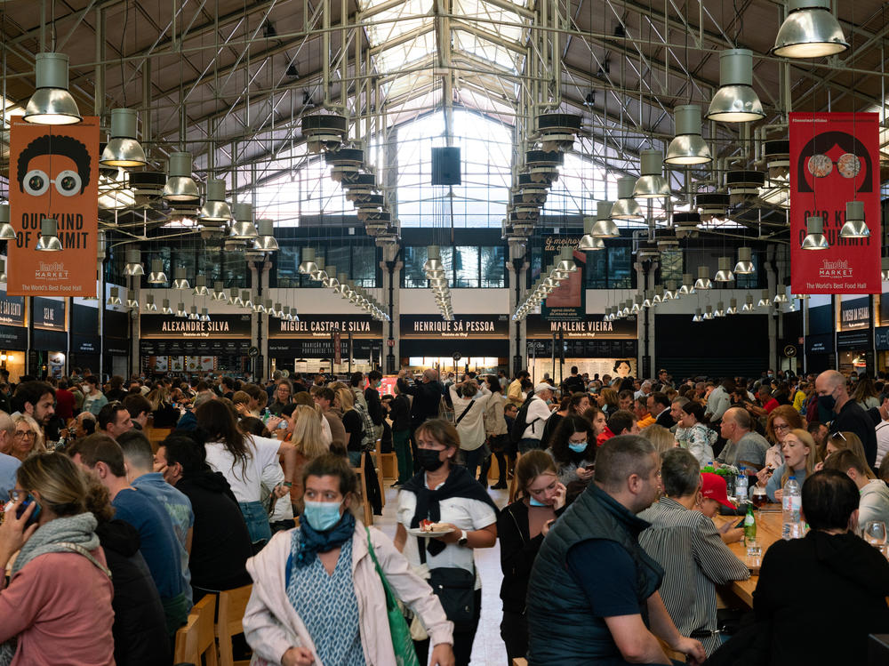Costumers gather for food and drinks at Time Out Market in Lisbon, Portugal.
