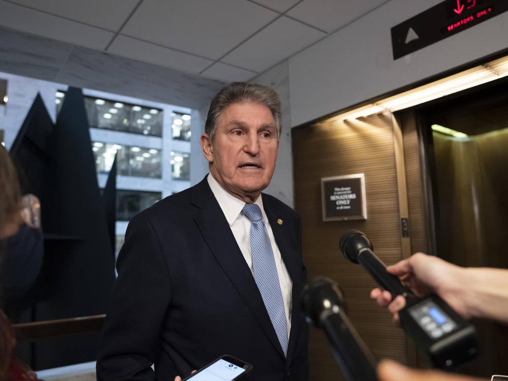 Sen. Joe Manchin, D-W.Va., leaves his office after speaking with President Biden about his long-stalled domestic agenda, at the Capitol on Monday.