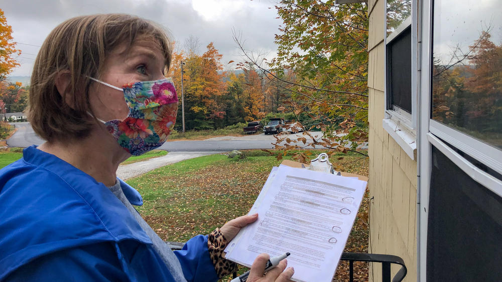 Planned Parenthood volunteer Sarah Mahoney talks to a voter about abortion access outside a home in Windham, Maine on Oct 16, 2021.