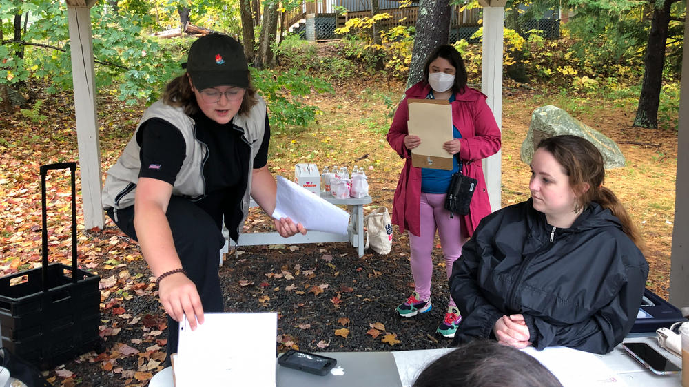 Planned Parenthood organizer Katie McClelland (L) gives a pep talk to volunteers outside the library in Windham, Maine, on Oct. 16. The volunteers then fan out to different neighborhoods to engage in 