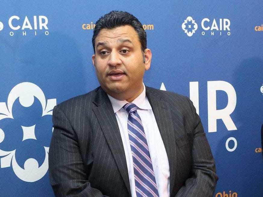 Romin Iqbal (center) of the Council on American-Islamic Relations (CAIR) attends a press conference at CAIR-Columbus headquarters in Columbus, Ohio, in 2018. Iqbal was terminated for sharing information about the organization to 