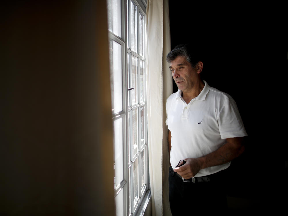 Claudio Rojas, a 55-year-old handyman who was deported from the U.S. in 2019, poses for a photo in his home in Moreno, Argentina, on May 8, 2021. His wife, two sons and two grandsons remained in Florida while Rojas was in Argentina.