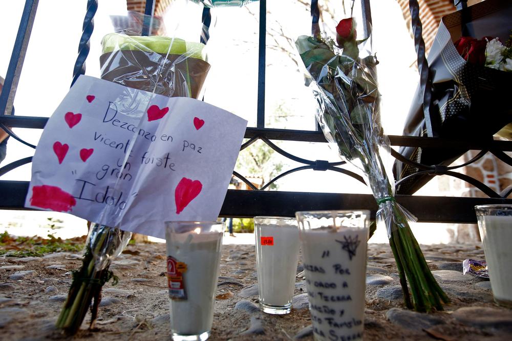 View of candles and flowers to honor Mexican singer Vicente Fernández outside the Rancho los Tres Potrillos in Tlajomulco, Mexico, on Dec. 12, on the day of his death. Fernández, the most important representative of ranchera music in Mexico, died Sunday in Guadalajara at 81, after remaining in the hospital for almost five months due to a domestic accident, his family informed.