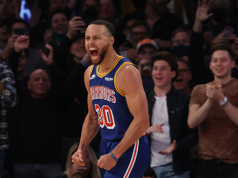 Golden State Warriors point guard Steph Curry celebrates after making a 3-point basket to break Ray Allen's record during a game against the New York Knicks on Tuesday.
