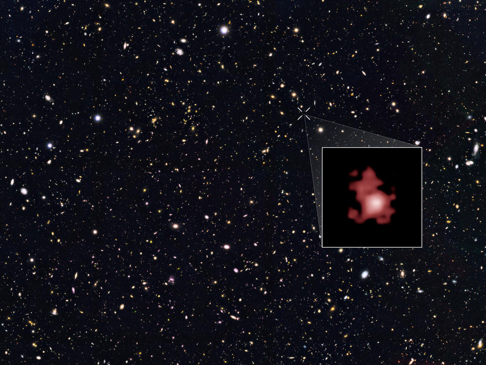 The most distant galaxy ever discovered, GN-z11, is shown within a Hubble Space Telescope deep sky survey and highlighted in the inset. This galaxy existed only 400 million years after the Big Bang.
