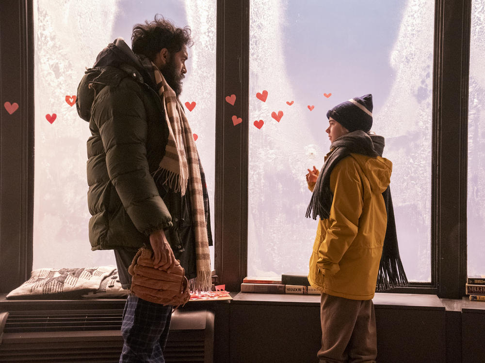 Jeevan (Himesh Patel) takes Kristen (Matilda Lawler) under his wing as a virus ravages humanity in HBO Max's <em>Station Eleven.</em>