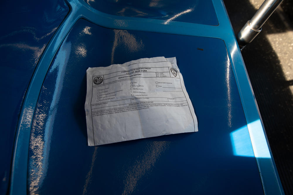 In addition to being one of the only ways into Rikers Island, the Q100 bus is also one of the only ways out. Seen here: a former detainee leaves behind an incarceration report.