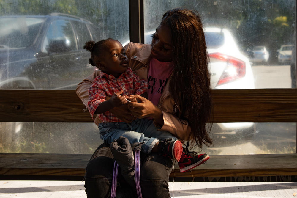 Overwhelmingly, the passengers of the Q100 are women. Toya (last name withheld) is bringing her son to see his dad. She says her husband's lack of medical attention has been terrifying.