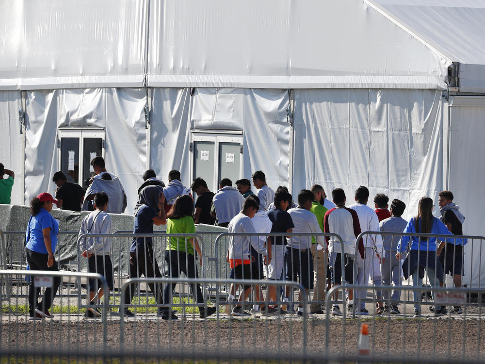 Children line up to enter a tent at the Homestead Temporary Shelter for Unaccompanied Children in Homestead, Fla., in Feb. 2019 The American Civil Liberties Union and other attorneys filed a lawsuit on behalf of thousands of immigrant families who were separated at the U.S.-Mexico border on Oct. 3, 2019.