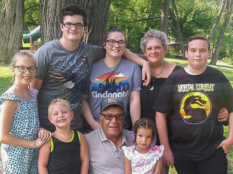 Jesus and Suzanne Valle pose with their adopted children in Art Van Atta Park in Dayton, Ohio, in July. 