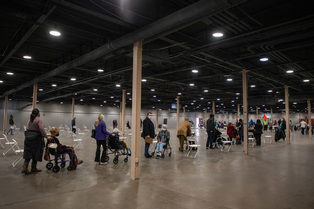 Long lines mostly comprising seniors and their caretakers during the first day of the mega vaccine center at Fair Park in Dallas on Jan. 11. <a href=