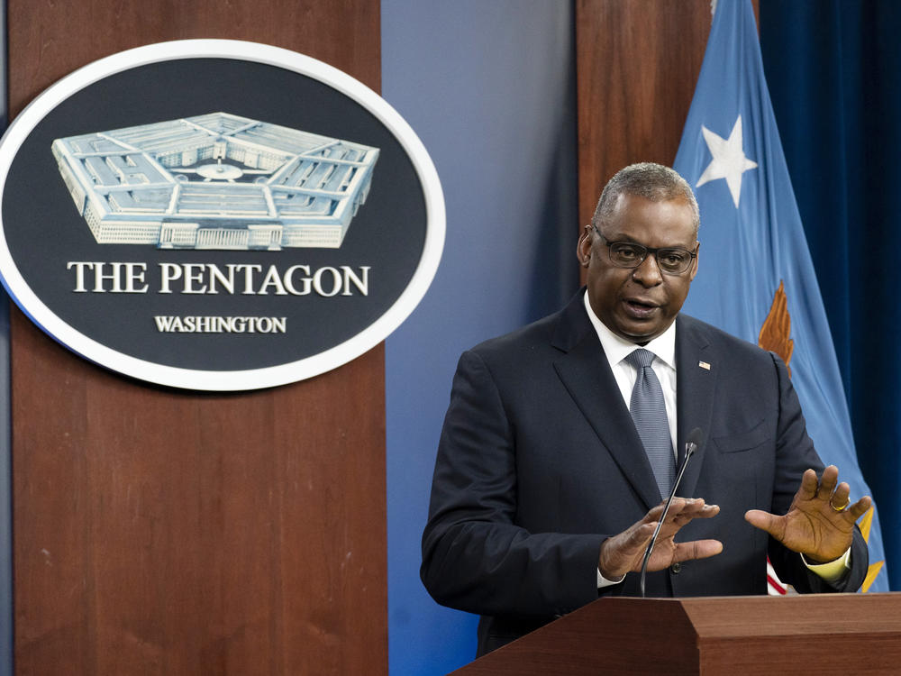 Secretary of Defense Lloyd Austin speaks during a media briefing at the Pentagon last month. The military branches have begun discharging people who refuse to get vaccinated against COVID-19.