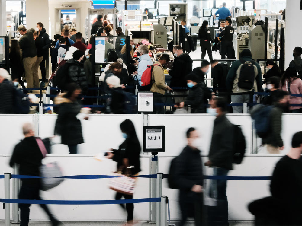 Travelers arrive for flights at Newark Liberty International Airport late last month. Flying domestically should be relatively safe as long as precautions are taken.