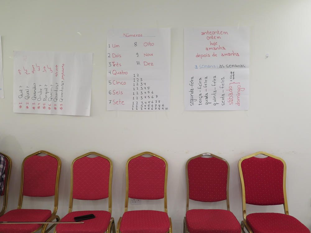 Basic Portuguese phrases and vocabulary are tacked up on the walls of the music institute classroom in Doha. The group of students, faculty and family members reached Lisbon last week.