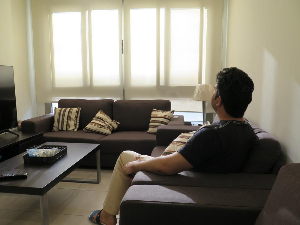 Wali, the Afghanistan National Institute of Music's program manager, sits in a classroom at the Park View Villas compound in Doha. 