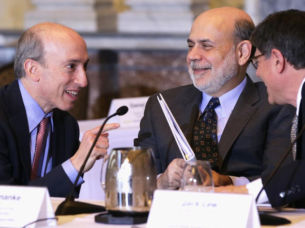 Gensler, then Chairman of the Commodity Futures Trading Commission, speaks with then-Federal Reserve Chairman Ben Bernanke and then-U.S. Treasury Secretary Jacob Lew during a meeting of financial regulators on Dec. 9, 2013, at the Treasury Department in Washington, D.C. Gensler has years of experience as a regulator.