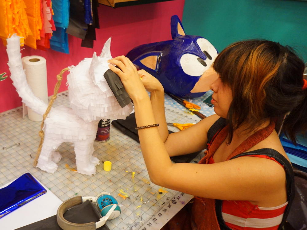 Yesenia Prieto, owner of Pinata Design Studio in L.A., working on a custom piñata.