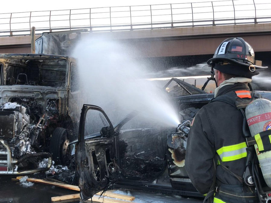 A firefighter works on the scene of a deadly pileup involving over two dozen vehicles near Denver in April 2019. Truck driver Rogel Lazaro Aguilera-Mederos was sentenced last week to 110 years in prison for causing the accident.