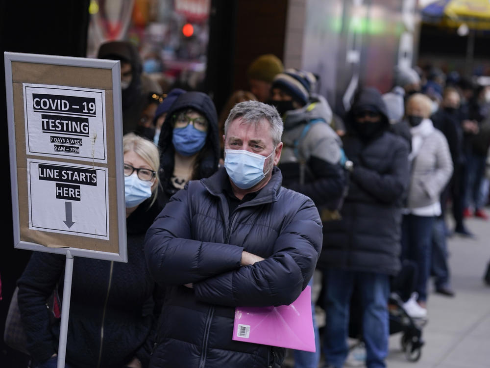 People wait in line at a coronavirus testing site in Times Square in New York on Dec. 13.