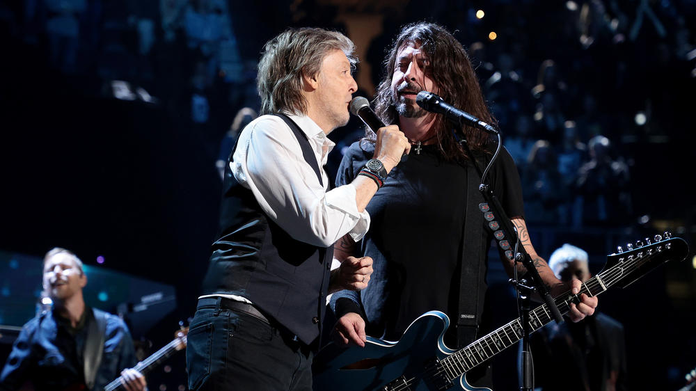 Paul McCartney performs with Dave Grohl during the Foo Fighters' induction into the Rock & Roll Hall Of Fame on October 30, 2021 in Cleveland, Ohio.