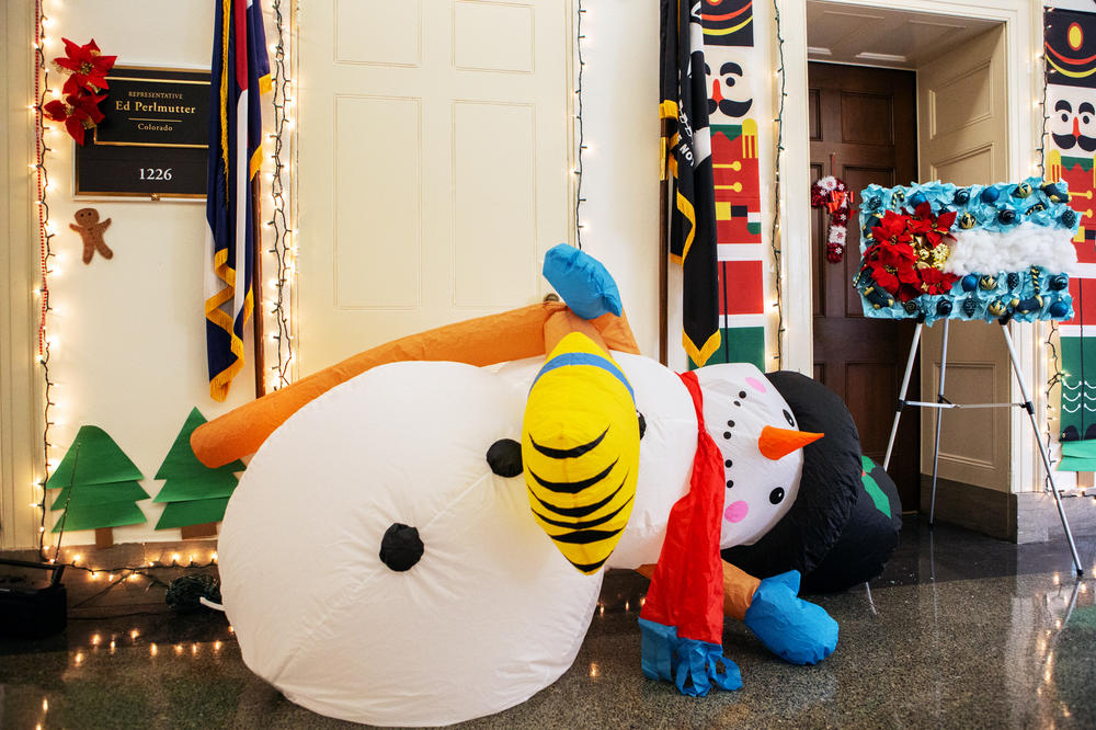 An inflatable snowman slowly deflates outside Rep. Perlmutter's door. He has repeatedly accused Colorado Democrat Rep. Jason Crow of tampering with the snowman.