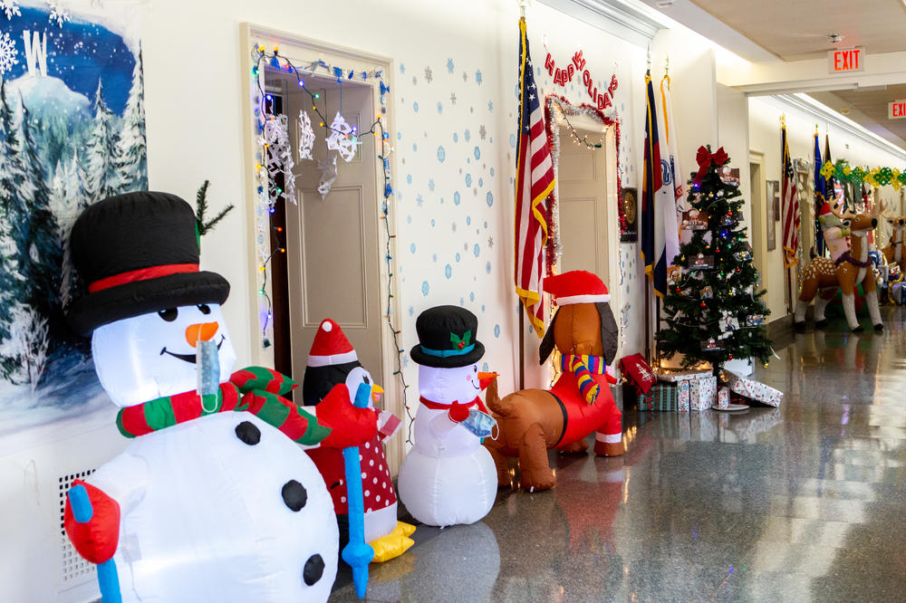 Holiday decorations are set up outside several offices. A friendly competition is sparked each year between members of Congress.