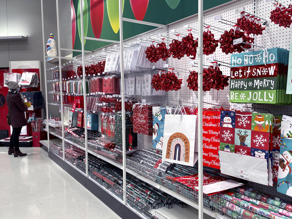 A shopper shops at a retail store in Glenview, Ill., Dec. 16. The National Retail Federation, the nation's largest retail trade group, said this month that the holiday shopping season appears to be on pace to exceed its sales growth forecast of between 8.5% and 10.5% despite additional challenges this year, from a new variant of the coronavirus, to soaring inflation.