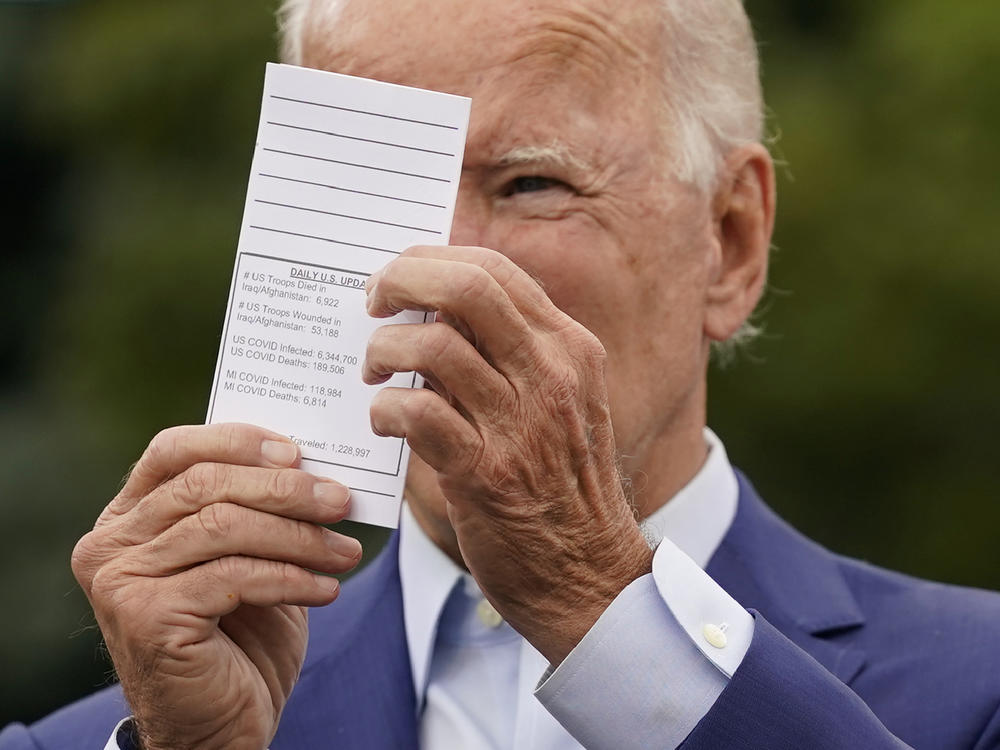When he was running for office, Joe Biden began frequently citing the number of COVID deaths from a card he carries in his pocket. This file photo is from Sept. 9, 2020.