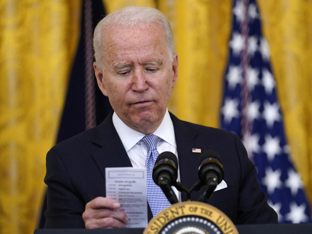 President Biden reads the number of COVID-19 deaths from a card he keeps in his pocket on July 29, 2021.