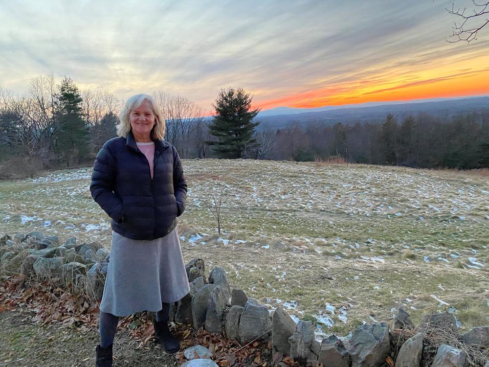 Marie-Pascale Traylor pictured on Dec. 21 in front of the Fruitlands property in Harvard, Massachusetts, where Louisa May Alcott lived with her family in the 1840s as part of an experimental utopian community. Traylor says she and her sisters loved Alcott's books growing up.