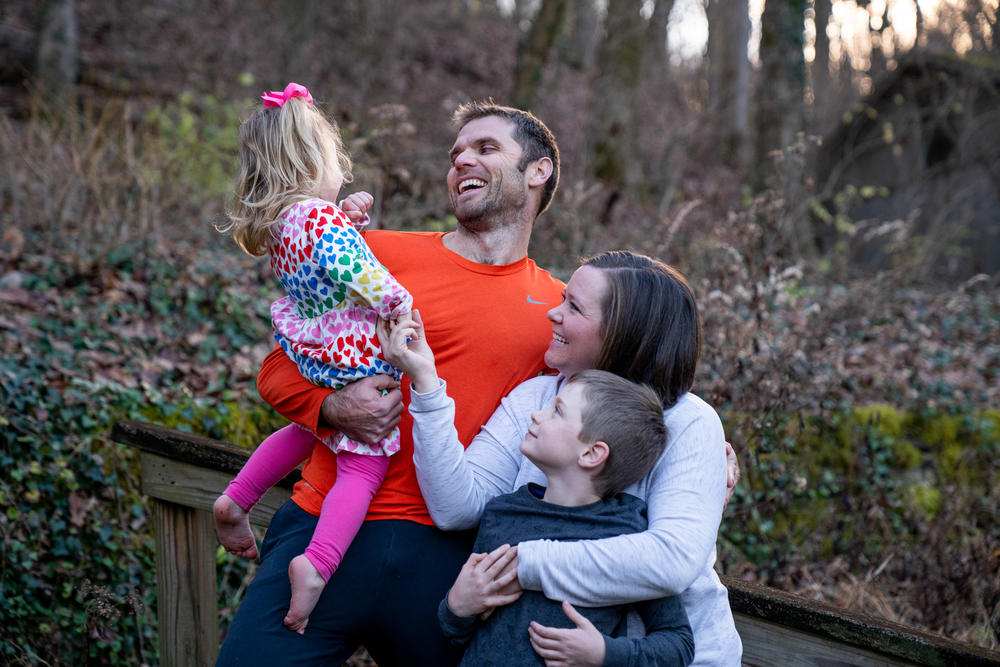 Blake Farmer with his wife Moriah Farmer, and two kids, Turner, 8, and Louisa, 2, in the backyard of their home in Nashville, Tennessee. After a family gathering over Thanksgiving, Louisa contracted COVID-19 after showing symptoms of coughing and sneezing. This resulted in breakthrough cases for the whole family, who navigated working remotely and having kids home from school for nearly two weeks.