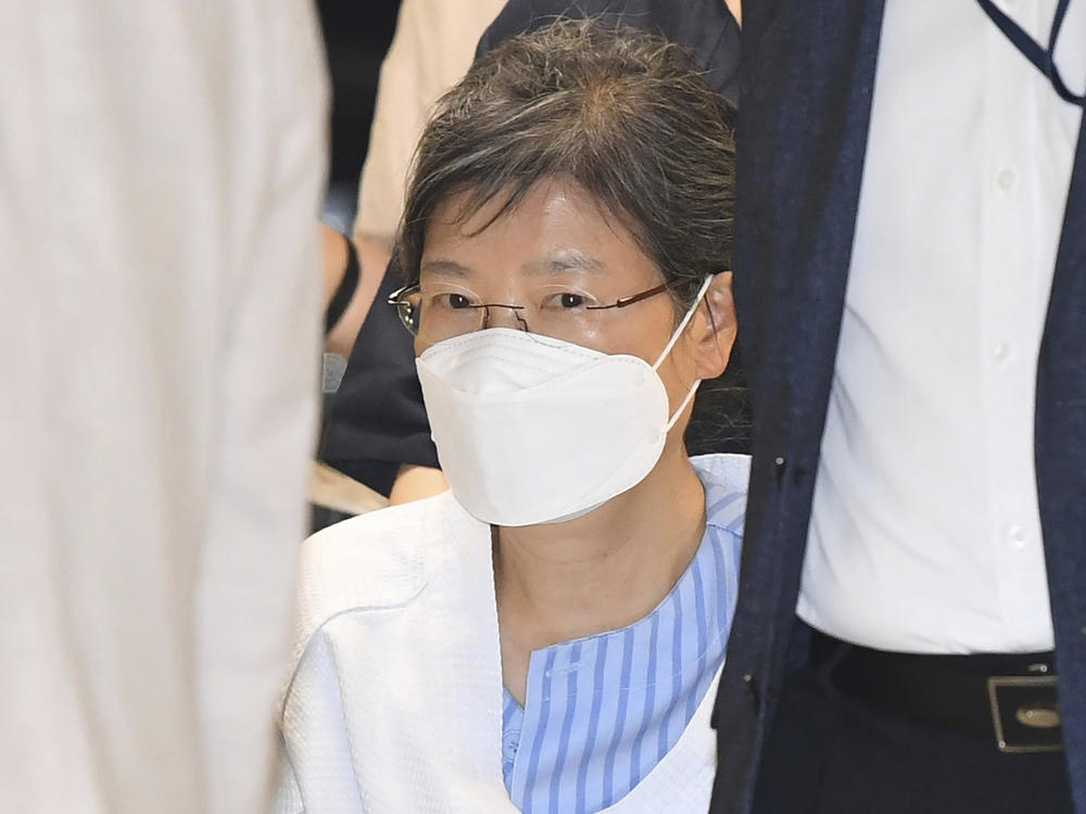 Former South Korean President Park Geun-hye arrives at a hospital in Seoul, on July 20, 2021. The government says it will grant a special pardon to Park, who is serving a lengthy prison term for a series of corruption charges.
