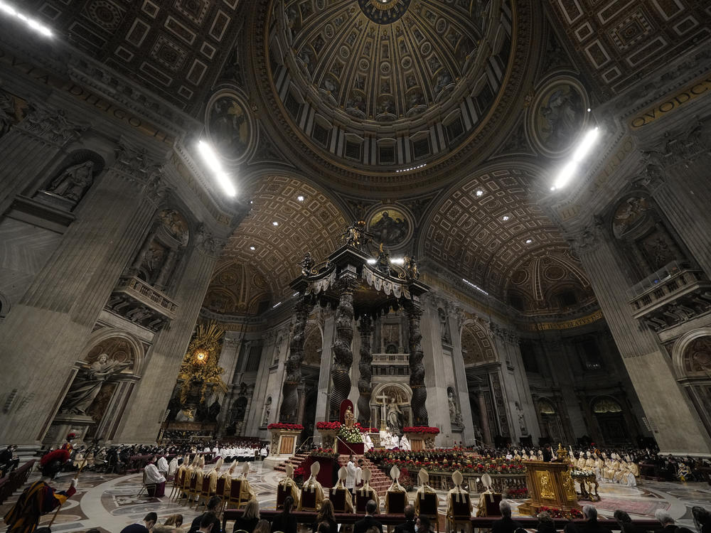 Pope Francis celebrates Christmas Eve Mass, going ahead with the service despite the resurgence in COVID-19 cases.