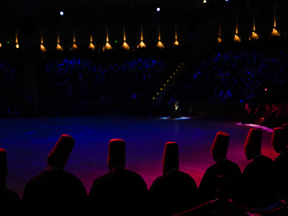 Whirling dervishes of the Mevlevi order perform during a Sheb-i Arus ceremony.