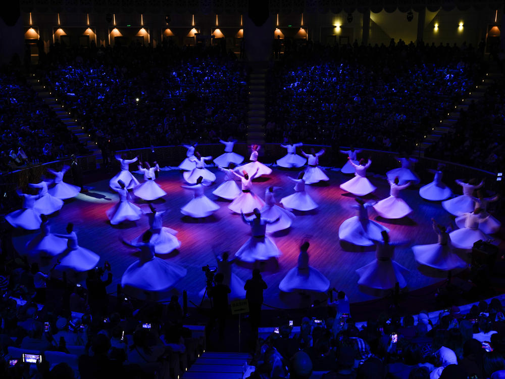 Whirling dervishes of the Mevlevi order perform during the Sheb-i Arus ceremony.