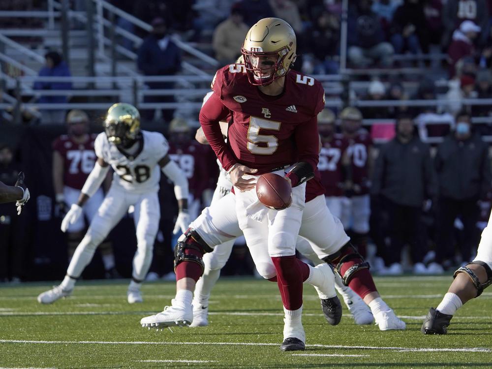 Boston College quarterback Phil Jurkovec prepares to hand the ball off during the second half of an NCAA college football game against Wake Forest on Saturday, Nov. 27 in Boston. The Fenway Bowl and Military Bowl have been canceled due to the pandemic as coronavirus outbreaks at Virginia and Boston College forced them to call off their postseason plans.