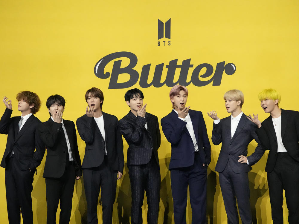 Three members of the K-pop superstar group BTS have been infected with the coronavirus, their Big Hit Entertainment agency said. Members of the group are seen here at a news conference to introduce their single 