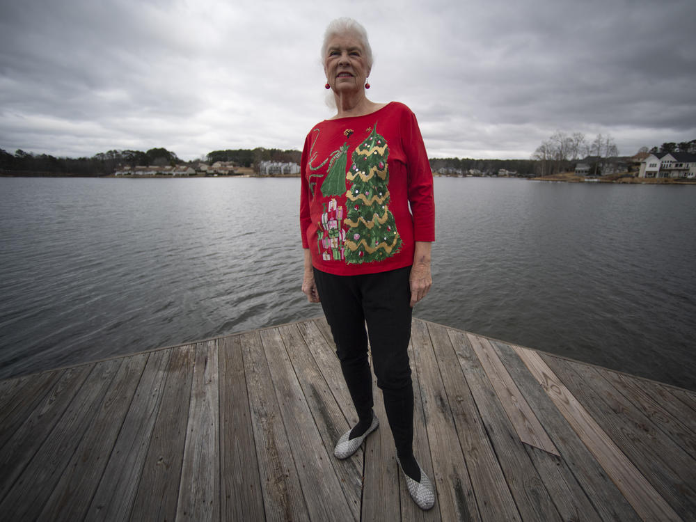 Wanda Olson poses for a photo in Villa Rica, Ga., on Dec. 17. When Olson's son-in-law died in March after contracting COVID-19, she and her daughter had to grapple with more than just their sudden grief. They had to come up with money for a cremation. Even without a funeral, the bill came to nearly $2,000, a hefty sum that Olson initially covered.