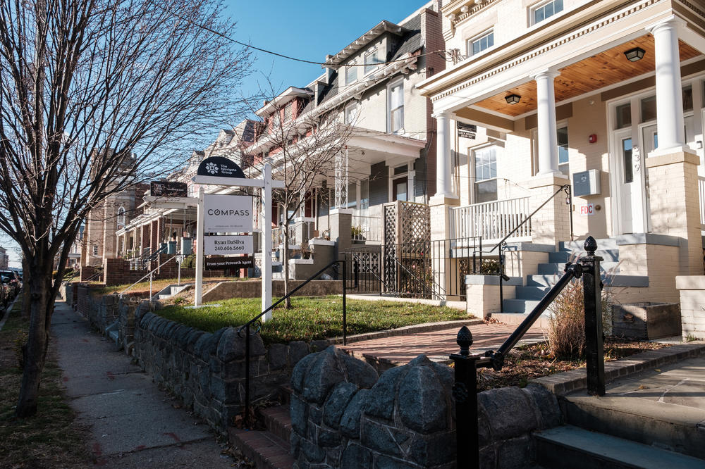 A for-sale sign stands in the yard of a home in the Petworth neighborhood of Washington, D.C.
