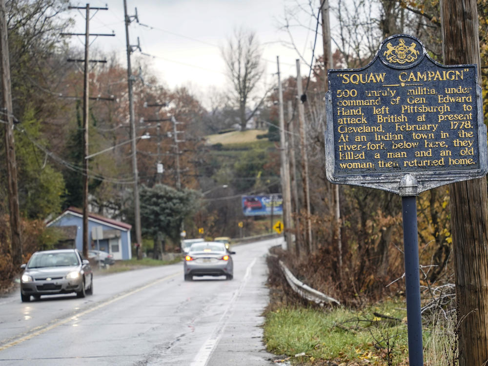 A Pennsylvania Historical and Museum Commission plaque is seen along a roadside in New Castle, Pa. A recent review of all 2,500 markers has resulted in the state removing two markers, revising two and ordering new text for two others so far.