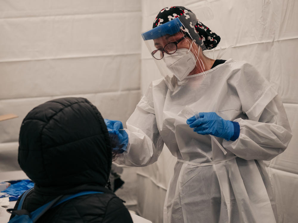 A medical worker administers a coronavirus test at a new testing site at the Times Square subway station in New York City on Monday.