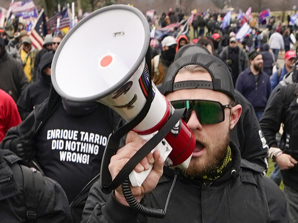 Proud Boys walk toward the U.S. Capitol in Washington in support of President Donald Trump on Jan. 6, 2021. A federal judge has refused to dismiss an indictment charging four alleged leaders of the group with conspiring to attack the Capitol.