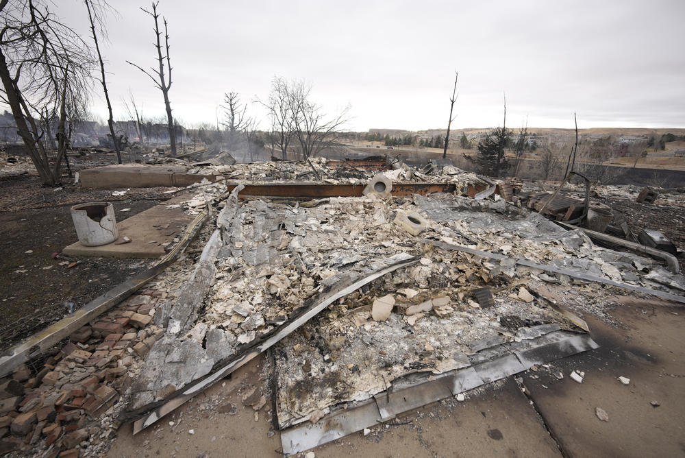 Dec, 31: Superior, Colo. — Debris surrounds the remains of homes burned by wildfires after they ripped through a development.