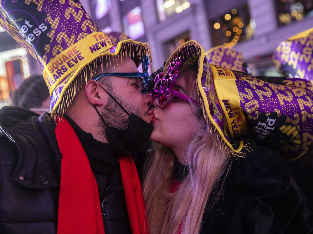 Christopher Munoz and Nirvana Contreras kiss during New Year's Eve celebrations in Times Square in New York.