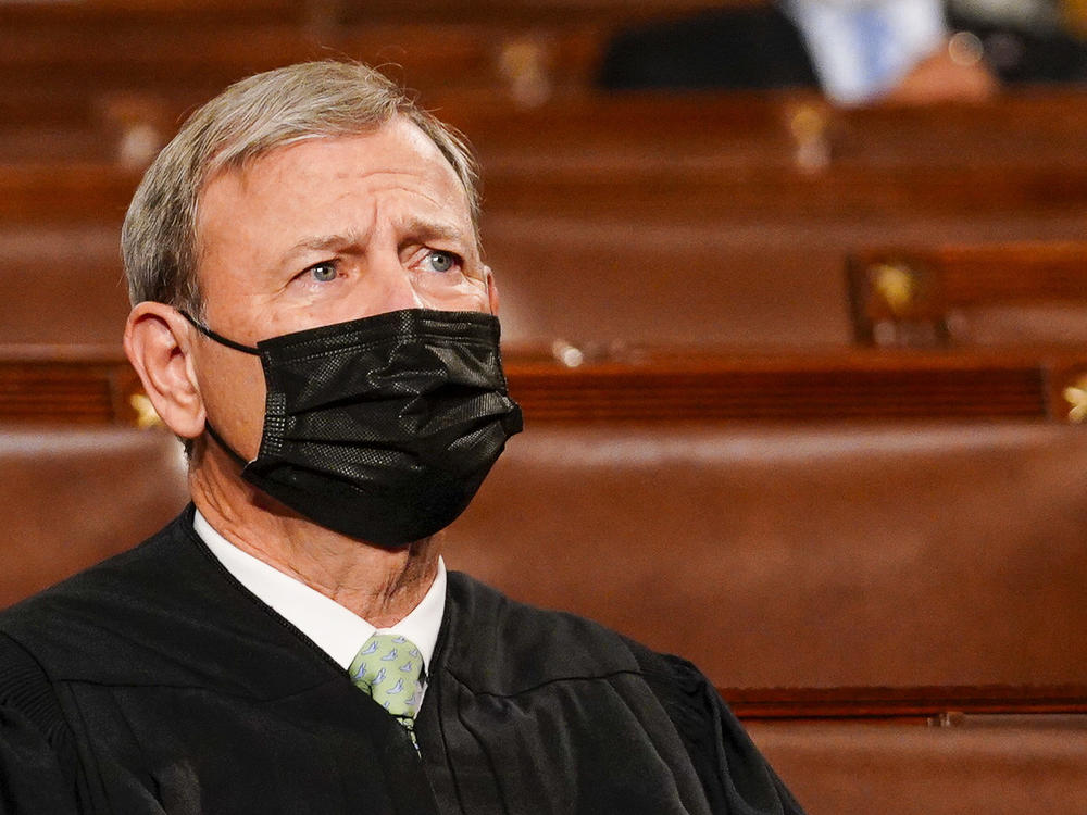 Chief Justice John Roberts listens as President Biden addresses a joint session of Congress on April 28.